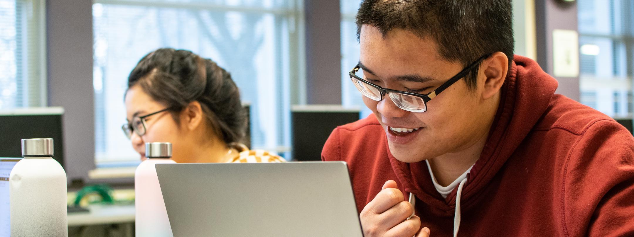 Students working on assignments in the tutoring center.